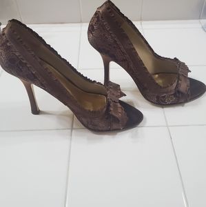 Jlo brown open-toe heels.